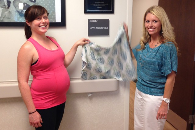 Blanchfield Army Community Hospital patient Cara Somma and BACH nurse midwife Jessica Jensen unveil the Mother's Room dedication plaque