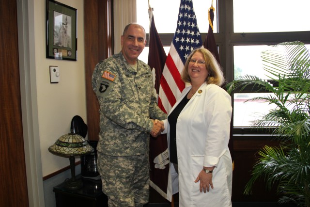 Tripler Commander shakes hands with hospital lactation consultant
