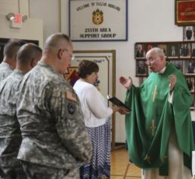 Chaplain (Lt. Col.) Edward Coyle, conducts his last mass as a chaplain