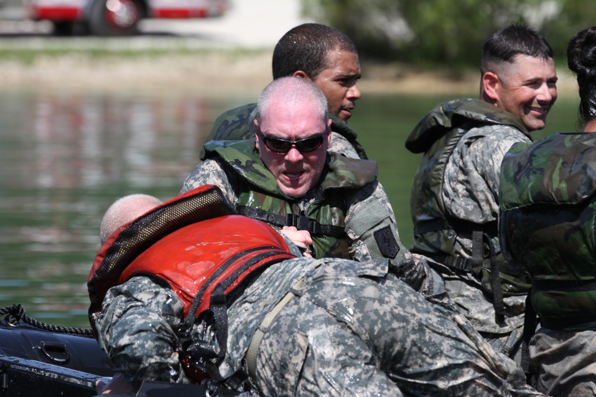 4th Maneuver Enhancement Brigade troops dive into water operations ...