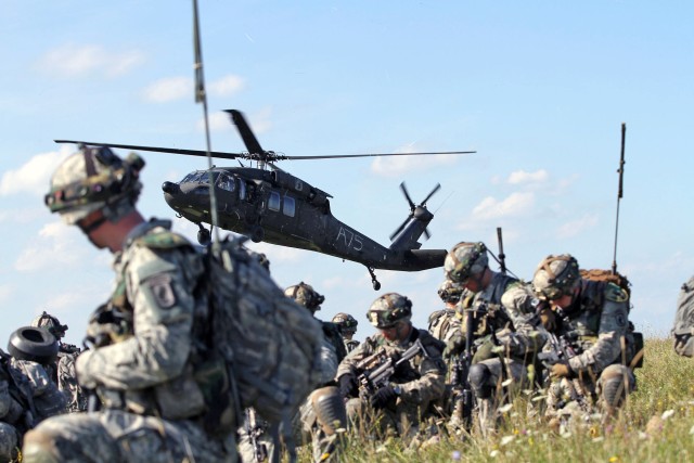 173rd Airborne Brigade paratroopers air assault through mock village during Saber Junction 14