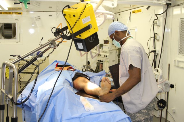 Portable x-rays are taken in the field operating room during 121st Combat Support Hospital mass casualty exercise.