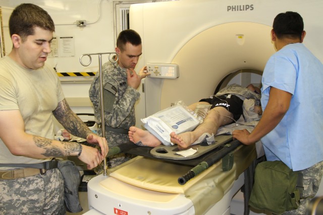 Simulated casualties were examined in a CT Scanner during the 121st Combat Support Hospital mass casualty exercise.