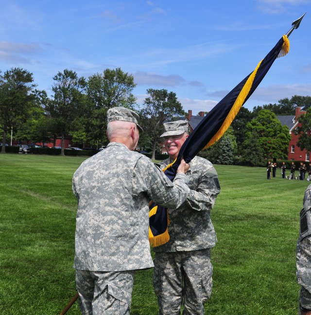 Brigadier General Mark S. Inch accepts the CID colors 