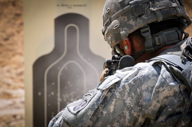 Paratrooper fires at target