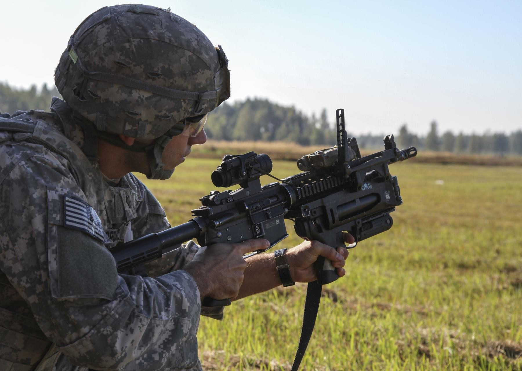 Sky Soldiers and Iron Wolves train together on M320 range