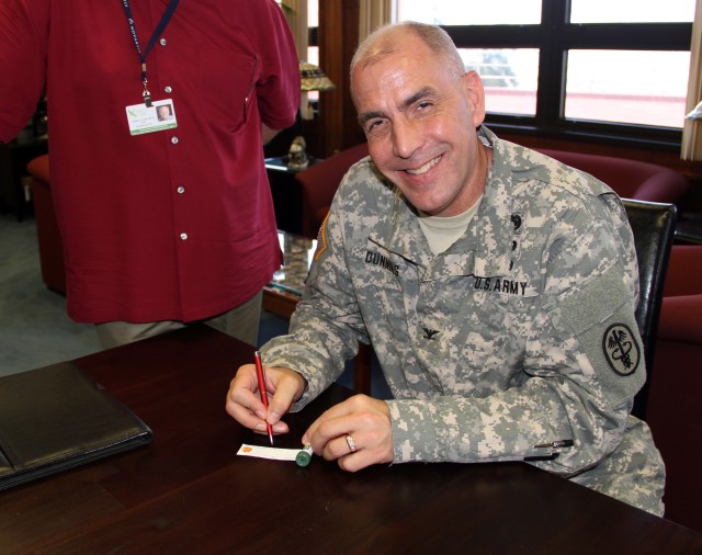 Col. David Dunning participates in the nation-wide Hospital CEO Rose Dedication in honor of organ donors