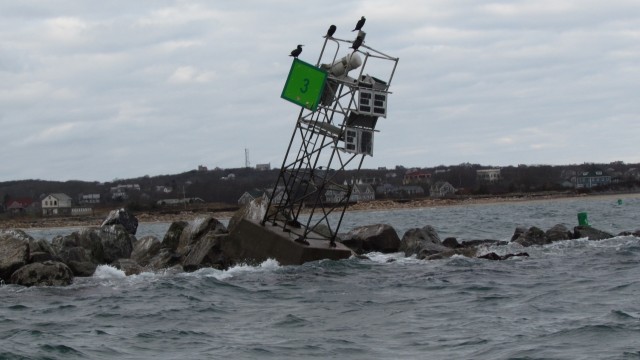 Aid to Navigation damaged from Superstorm Sandy barely sits atop the Block Island Jetty on Block Island, Rhode Island                               