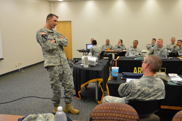 Sgt. 1st Class Ohman uses a sales technique on fellow recruiter