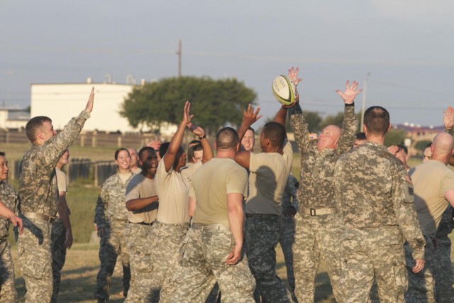 Cav officers work together, over obstacles