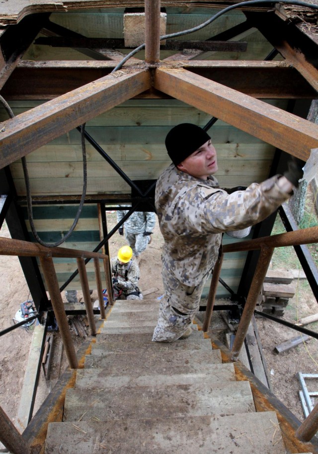 Latvian and US engineers construct a rappel tower