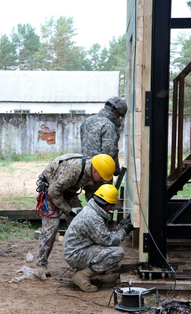 Latvian and US engineers construct a rappel tower