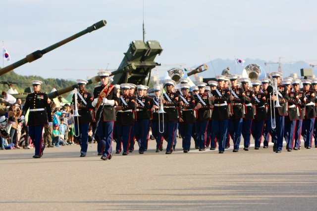 The III Marine Expeditionary Force Band performs during a parade at the 2014 RoK Ground Forces Festival, Gyeryong Korea Oct. 3, 2014