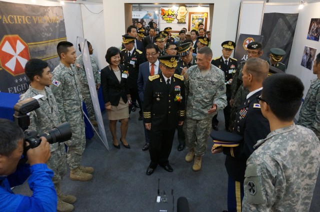 Chief of Staff of the Republic of Korea Army, Gen. Kim Yo-Hwan (center) receives a tour of the Eighth Army booth at the RoK Ground Forces Festival in Gyeryong, South Korea Oct. 1
