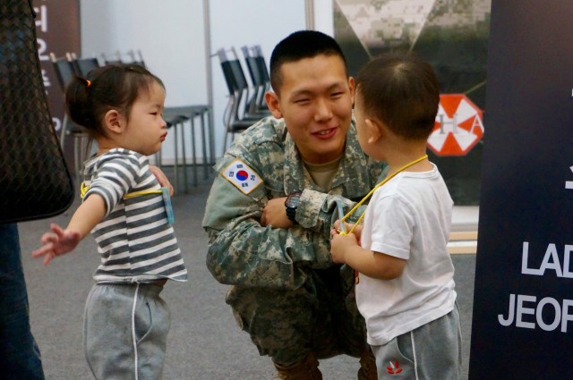 Korean Augment to the U.S. Army, CPL Lee Jin-Kil at the Eighth Army booth at the at the 2014 RoK Ground Forces Festival, Gyeryong Korea Oct. 1, 2014