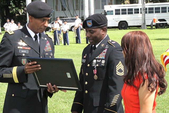 Gen. Brooks presents retirement certificate to Sgt. 1st Class Foster K. Folger