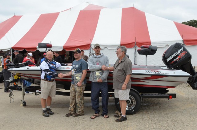 The winners of the 9th Annual Fishing for Freedom Tournament pose beside their 1st place prize