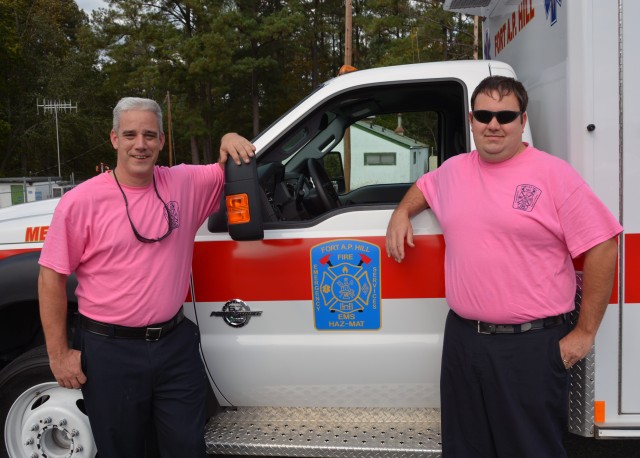 New Fire Medic Peter M. Orioles (left) and Fire Medic Dana A. Nichols were each given a commander's coin for their selfless service and quick response at the scene of an traffic accident off post.