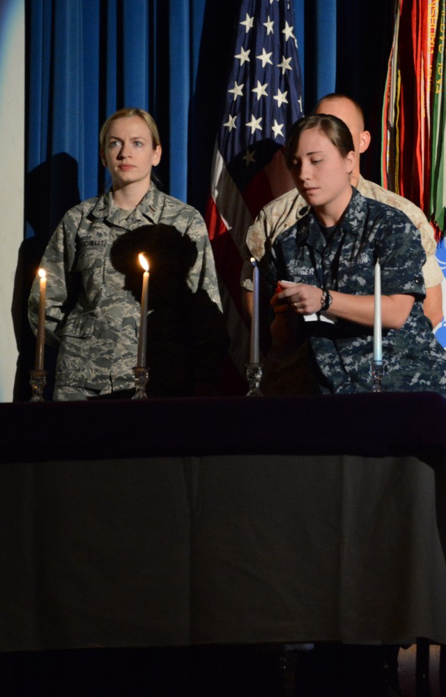 Speaker brings powerful message to end domestic violence, candle lighting