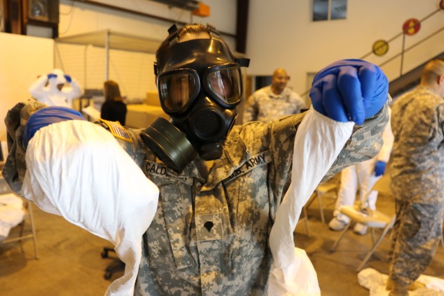 Soldier practices decontamination and removal