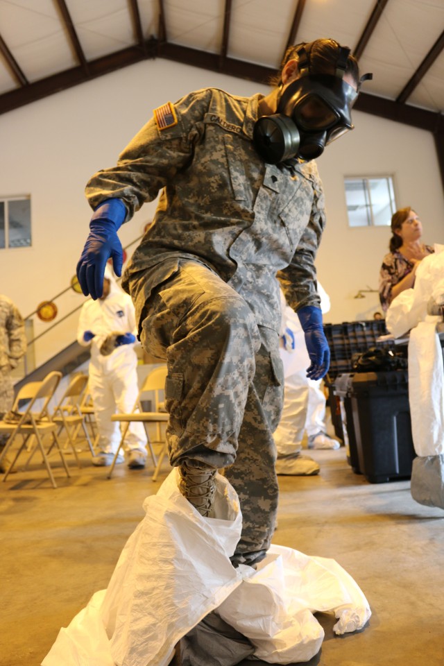 Soldier practices removal of protective gear