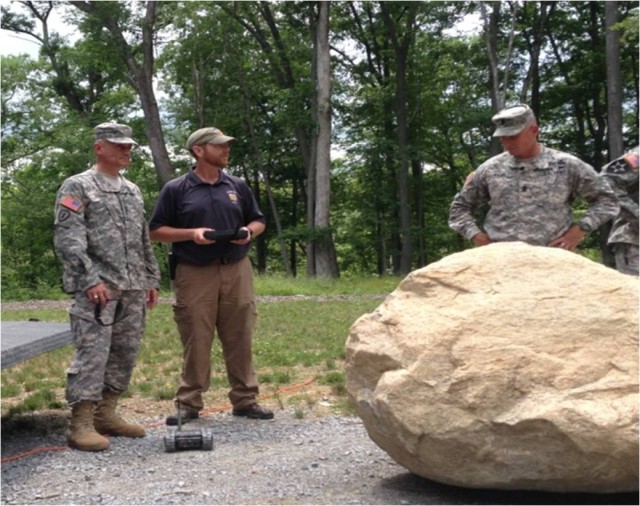 U.S. Military Academy (USMA) Superintendent Lt. Gen. Robert Caslen and USMA Command Sergeant Major Delbert Byers are briefed by trainers 