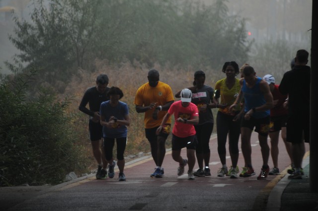 Nine members of the 2nd Inf. Div. prepare to start the 26.2 mile Shadow Marine Corps Marathon course