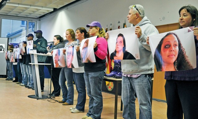 Domestic violence observance stresses fiding ways to help those in need