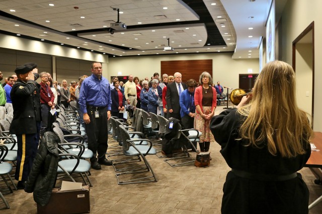 Army Reserve soldiers render salute during Veterans Day ceremony