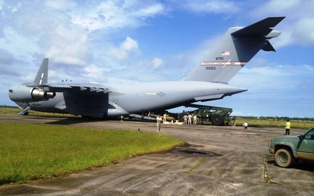 688th Rapid Port Opening Element unloads supplies and equipment from C-17 in Liberia.