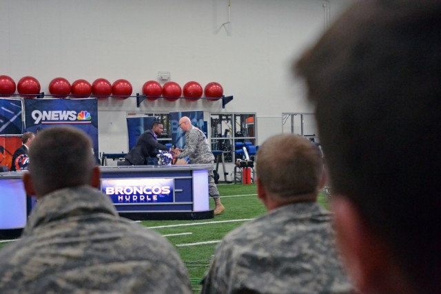 'Broncos Huddle' Soldiers, Airmen attend show
