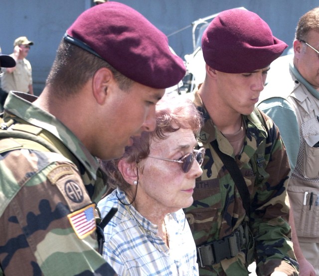 82nd Airborne escort an evacuee