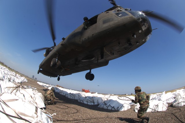 Cargo hooks supporting large bags of sand
