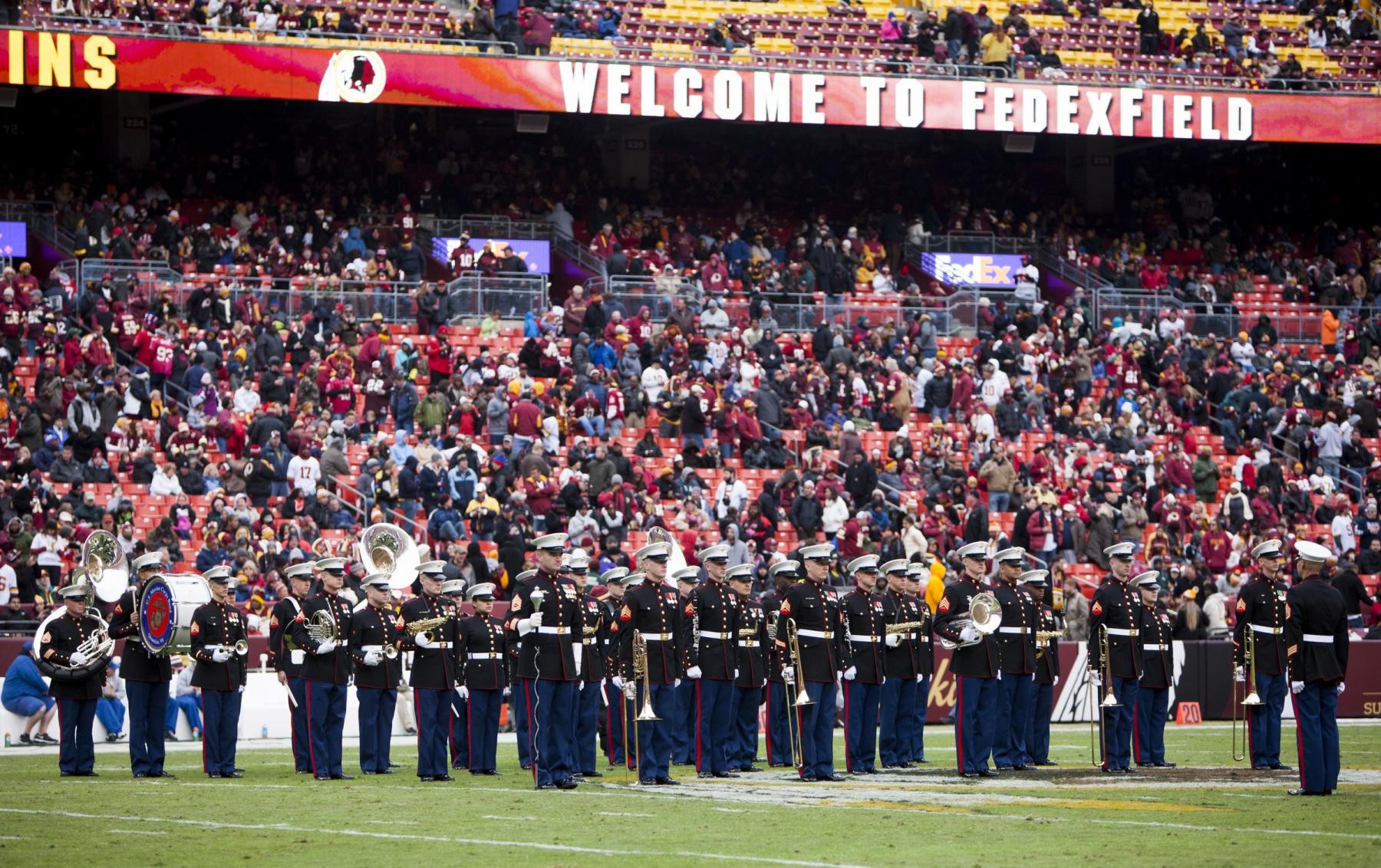 A U.S. Marine wears Salute to Service gloves before an NFL