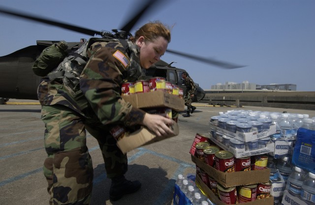 Medic unloads food and water