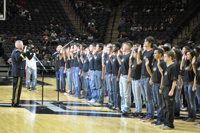 MICC leader swears in new recruits at Spurs game