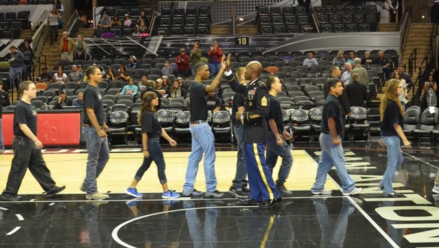 MICC leader swears in new recruits at Spurs game
