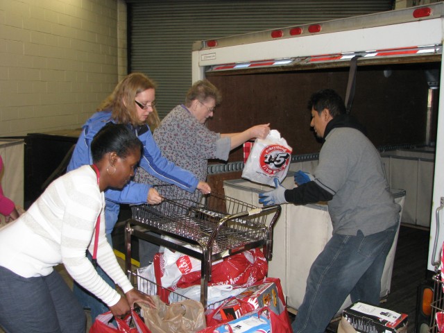 Corps of Engineers employees load toys, gifts for Angel Tree