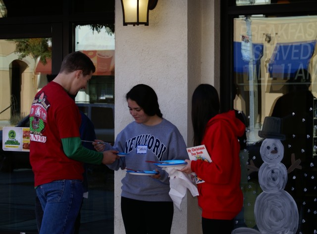 La Salle High School students decorate Fort Irwin's Towne Center for Christmas