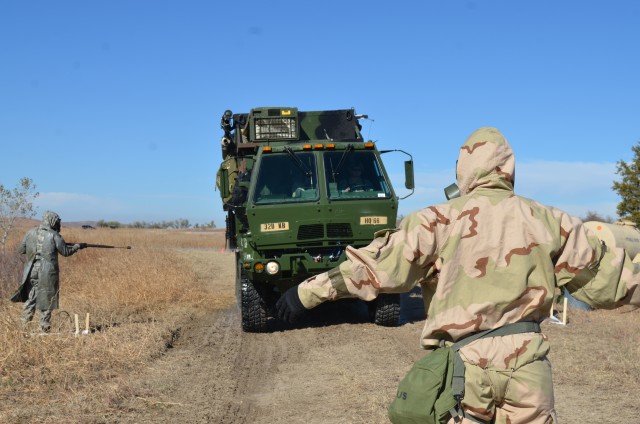 Soldier Directs Vehicle Decontamination