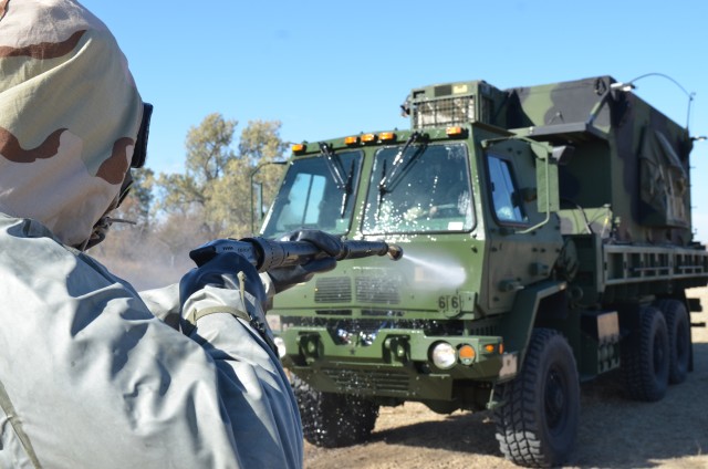 Soldier Conducts Vehicle Decontamination