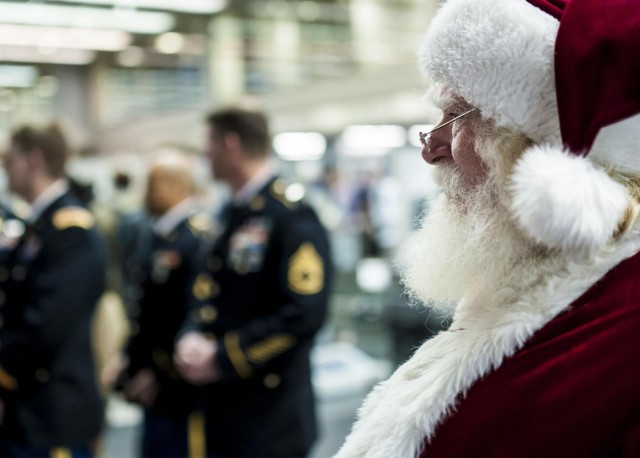 Military service members salute Gold Star children aboard the Snowball Express