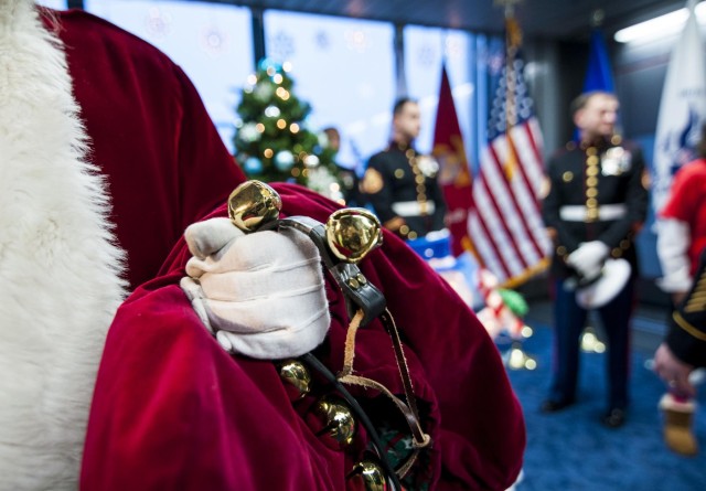 Military service members salute Gold Star children aboard the Snowball Express
