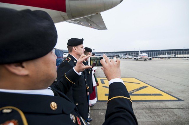Military service members salute Gold Star children aboard the Snowball Express