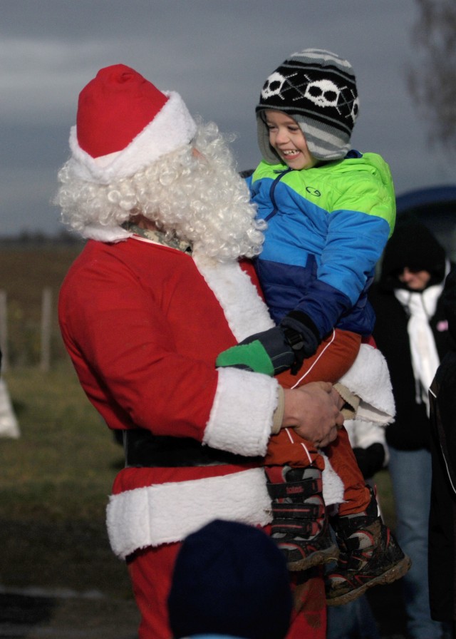 Santa jumps to deliver presents to KMC kids