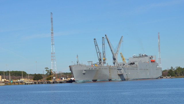 USNS Watkins docked in Charleston, S.C., is receiving a load of fresh military equipment.