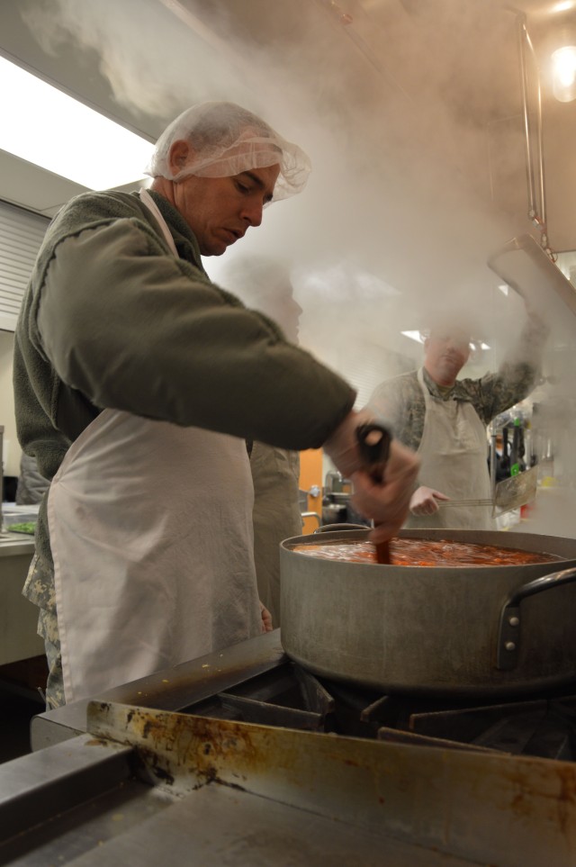 Staff Sgt. Dozier stirs a pot