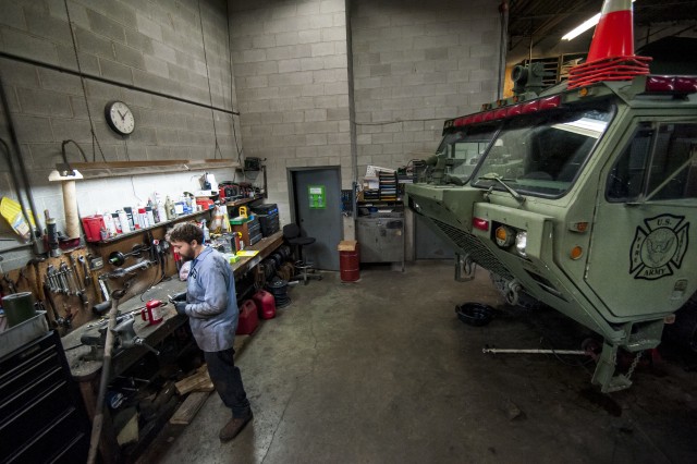 Opening the hose on Army fire truck maintenance 