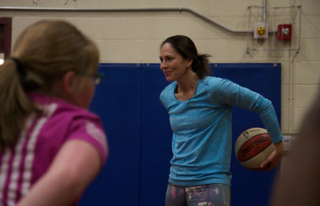 Sue Bird gets hands-on with military children in free basketball clinic