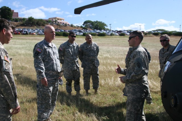 Command Sgt. Maj. Luciano talks with the crew